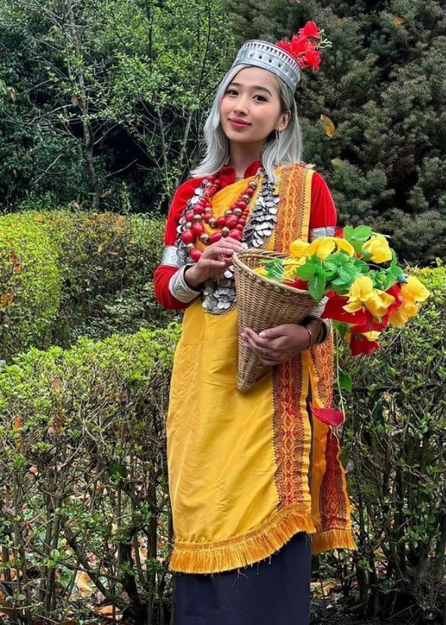 Woman in traditional Northeast Indian attire with flowers
